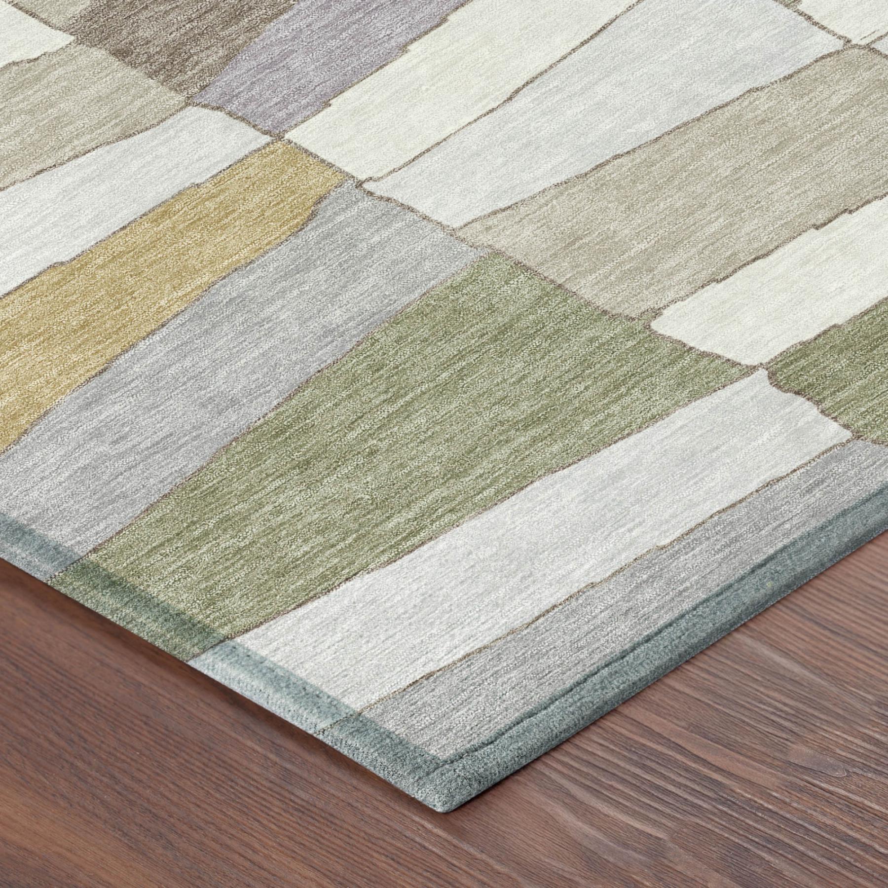 Geometric area rug corner view with cube pattern and border in gray, sage, and gold