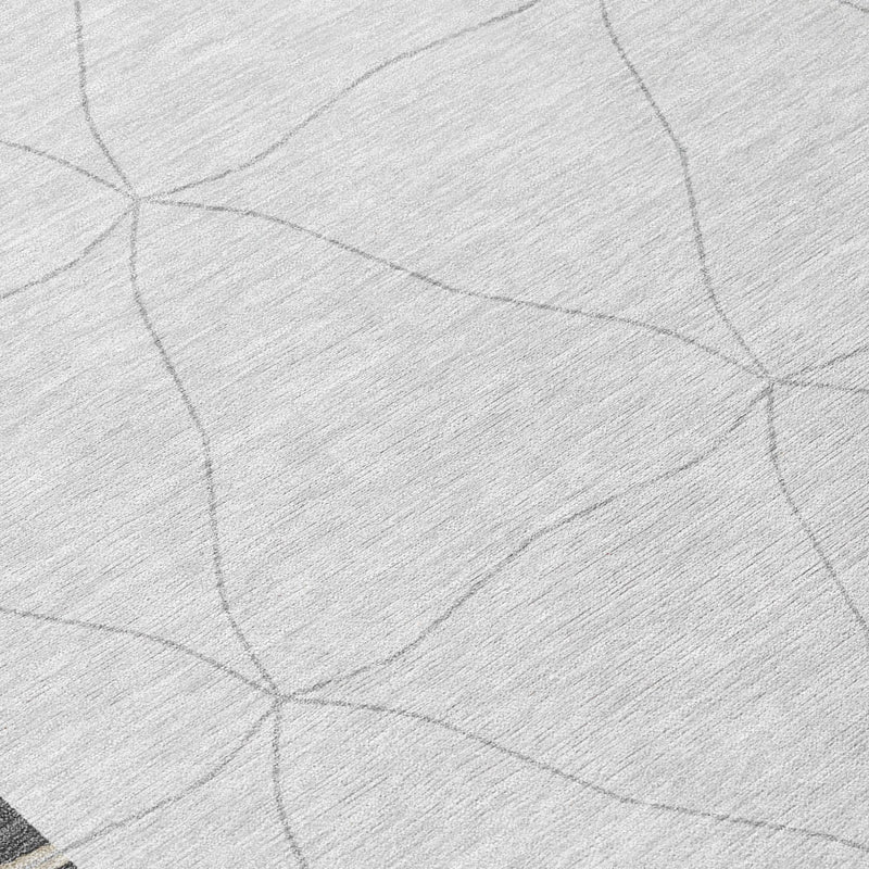 Light gray area rug with subtle geometric line pattern, close-up texture