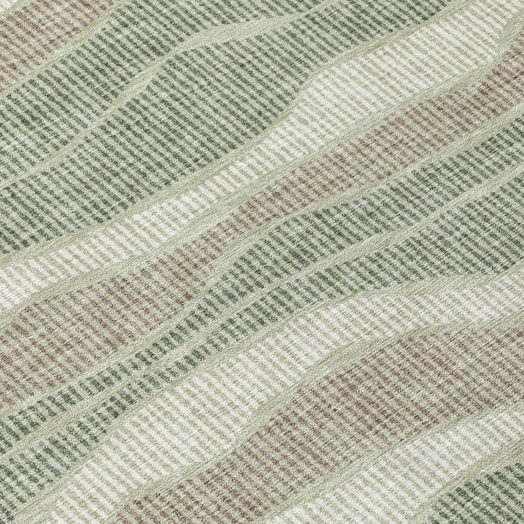 Close-up striped area rug with sage green, beige, and cream wavy bands texture