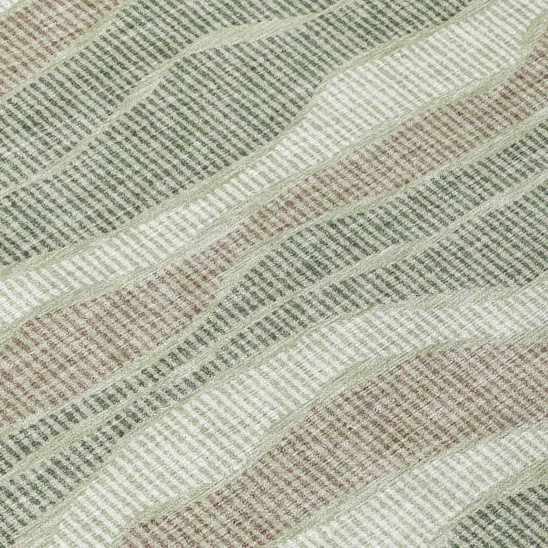 Close-up striped area rug with sage green, beige, and cream wavy bands texture
