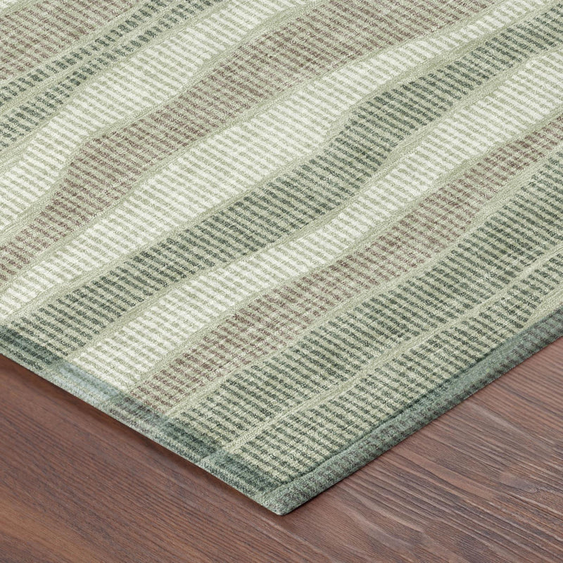 Rectangular area rug corner with wavy striped pattern in sage green and beige