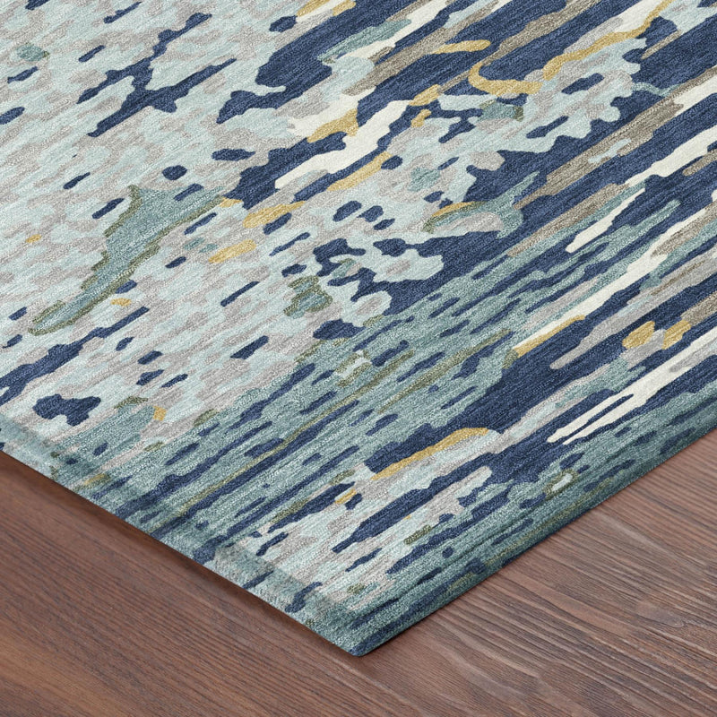 Navy-blue and light-blue abstract washable area rug, corner edge close-up