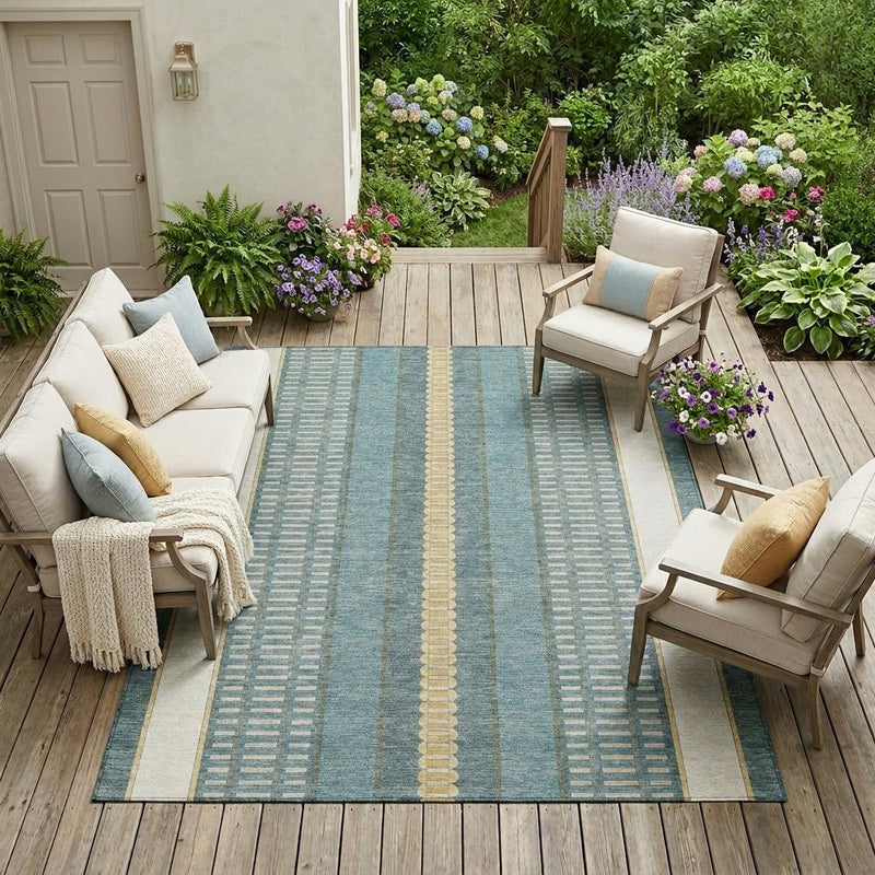 Indoor outdoor teal blue striped area rug with gold center stripe, bordered edges.