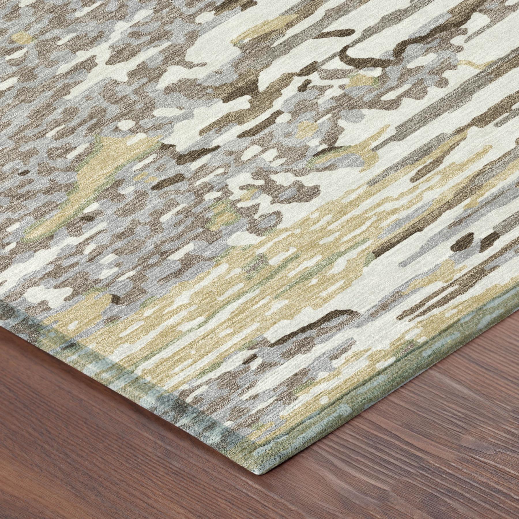 Ivory and silver abstract area rug with distressed pattern, corner edge visible