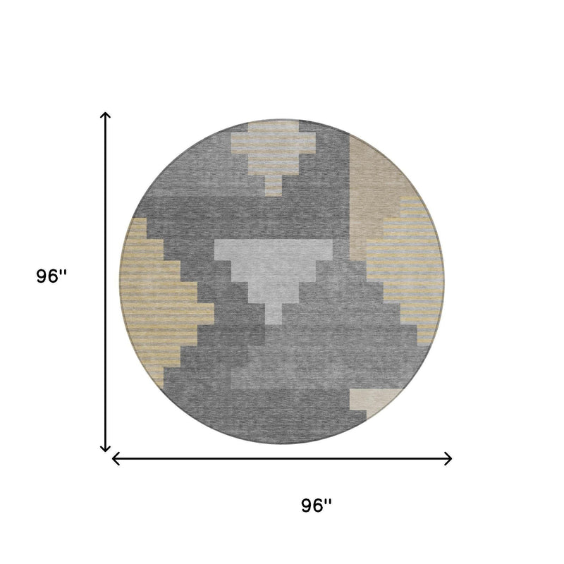 Round gray geometric area rug with beige and yellow block details