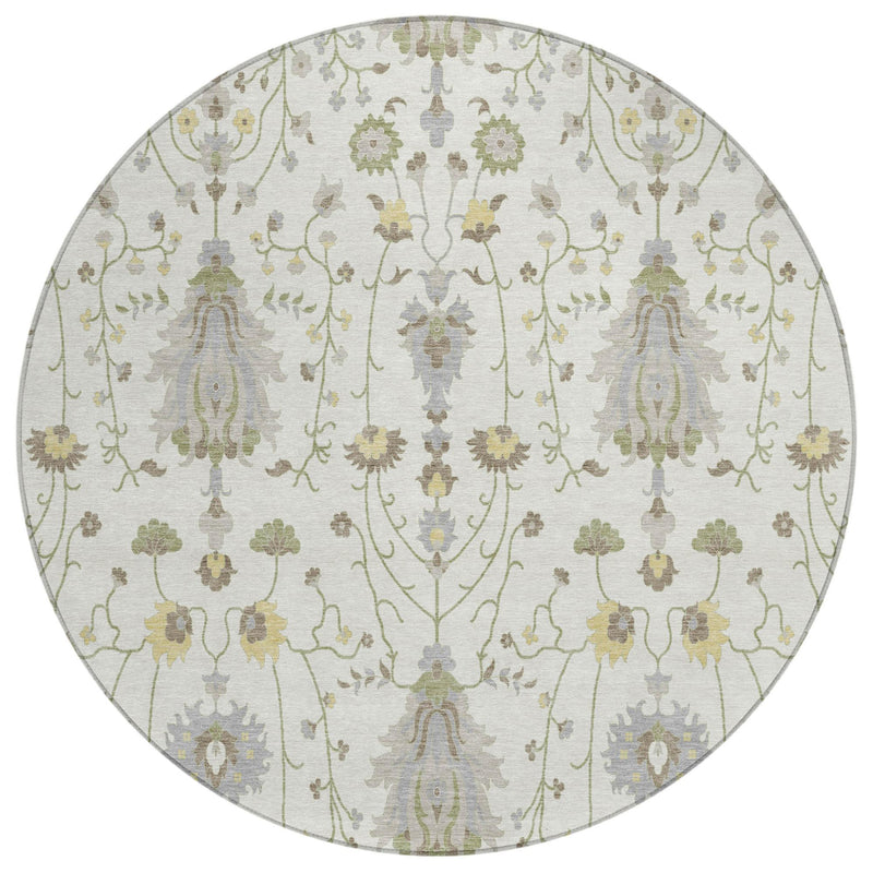 Round ivory rug with vertical medallion motifs in silver-gray and sage green