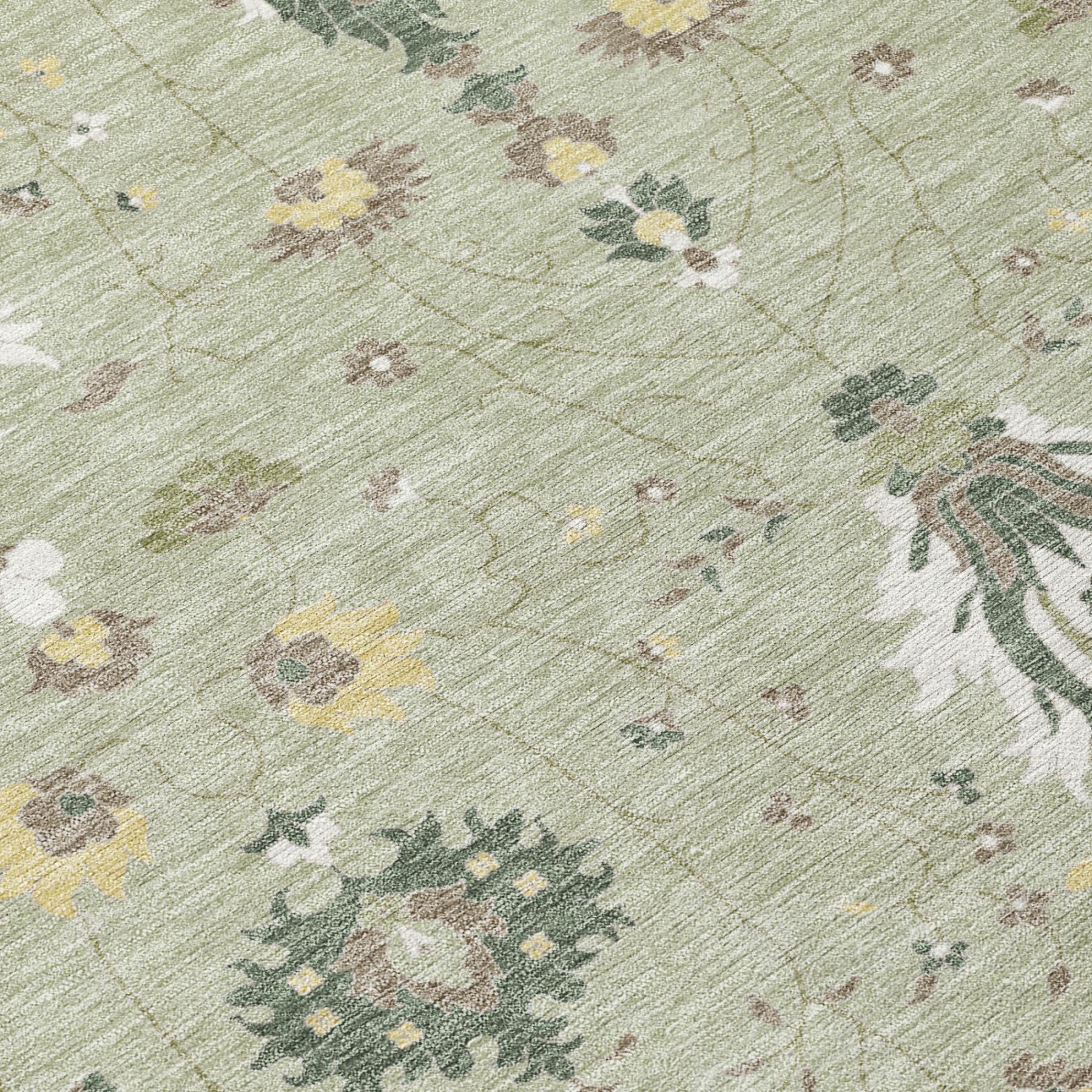 Sage green rug close-up with distressed floral and damask pattern texture