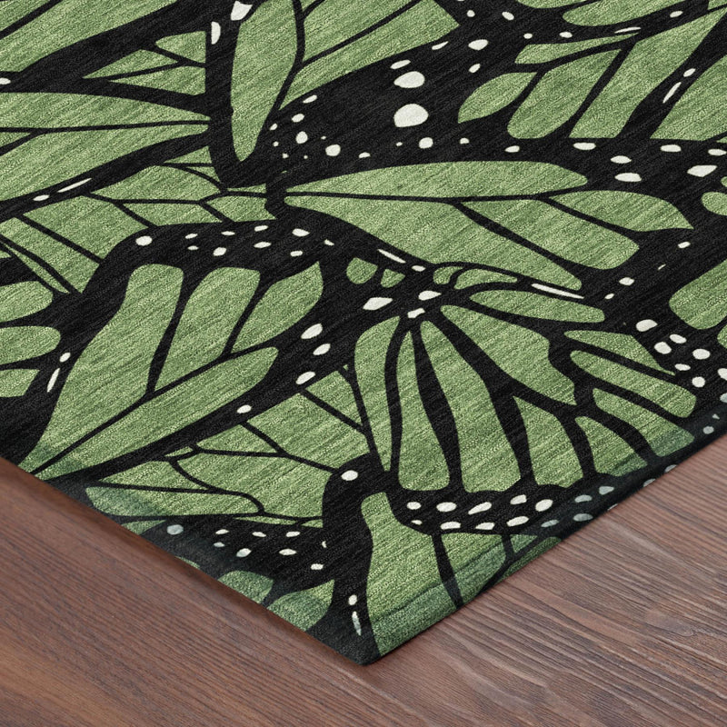 Green and black butterfly animal print area rug with layered leaf silhouettes