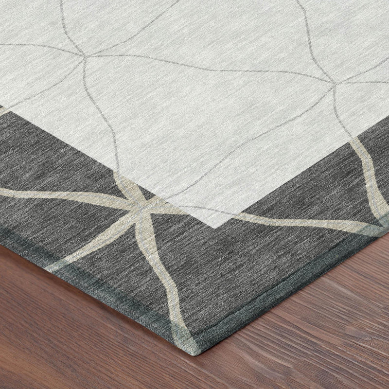 Corner of graphite and light gray geometric area rug with star border design