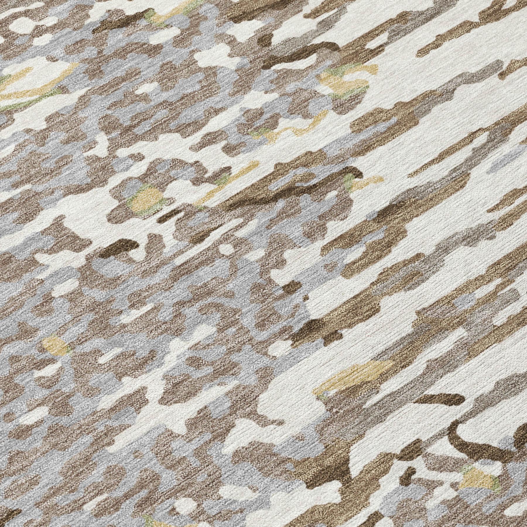 Close-up of ivory, gray, and silver abstract rug texture with scattered brush strokes.