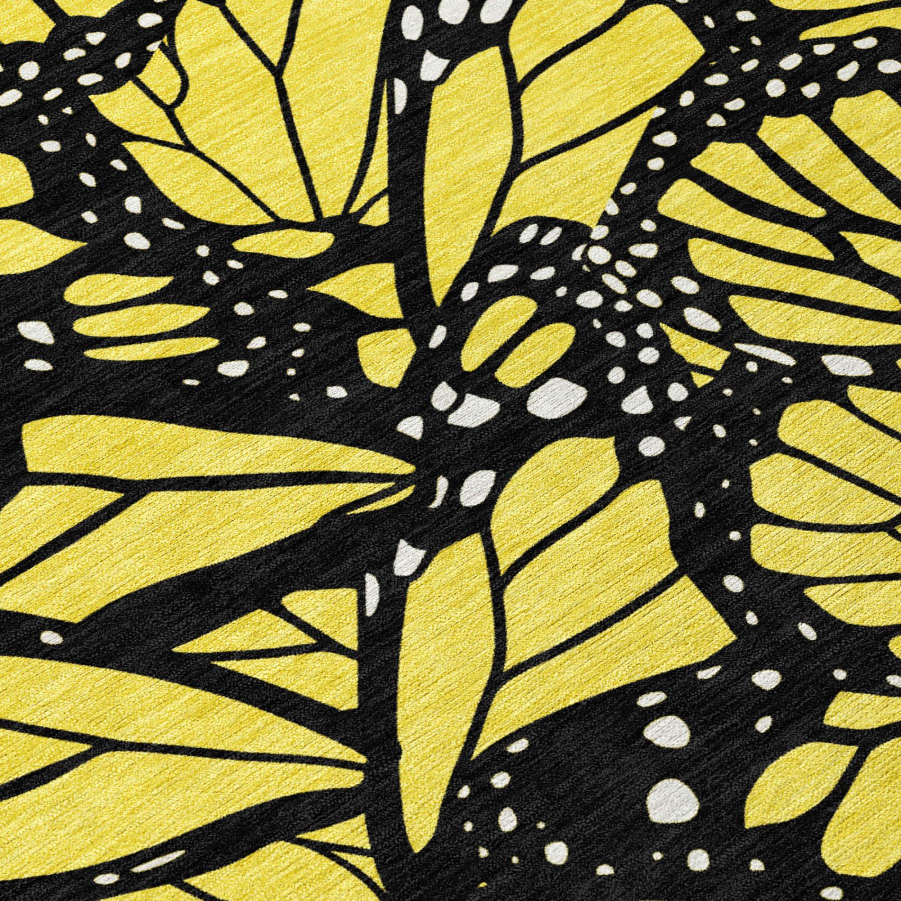 Close-up yellow and black animal print rug with butterfly and dot accents