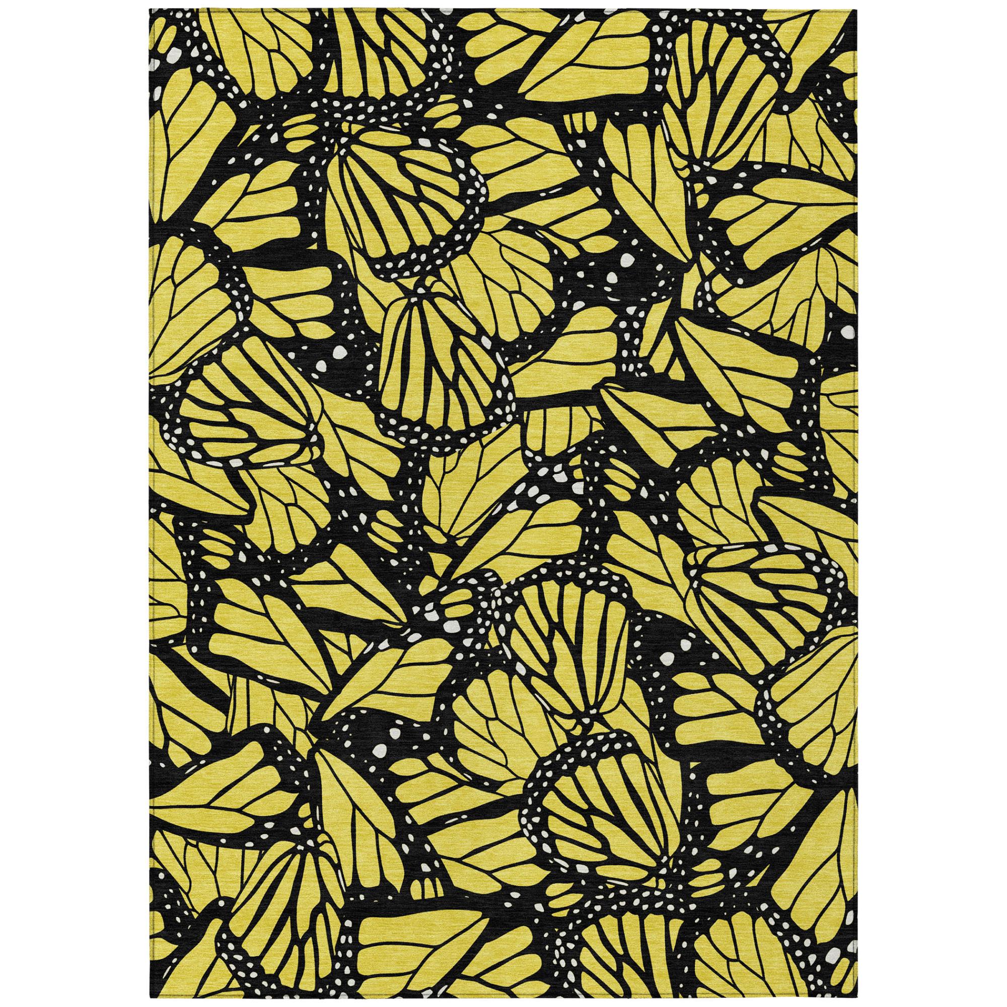 Yellow and gold animal print area rug with black floral patterns, rectangular design