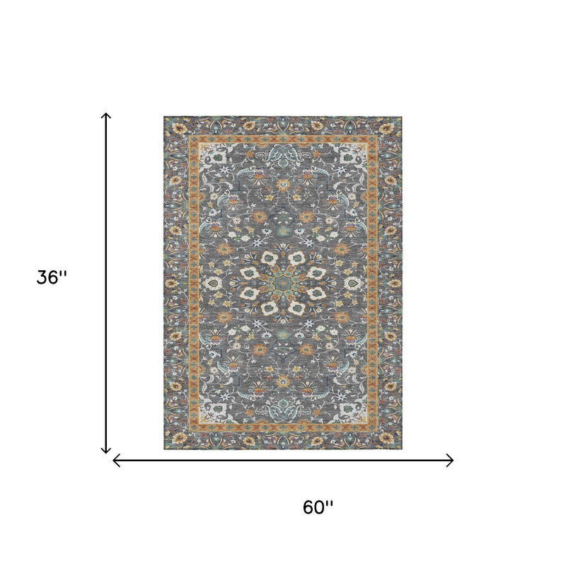 Gray oriental area rug, 36 in x 60 in, floral medallion with border.