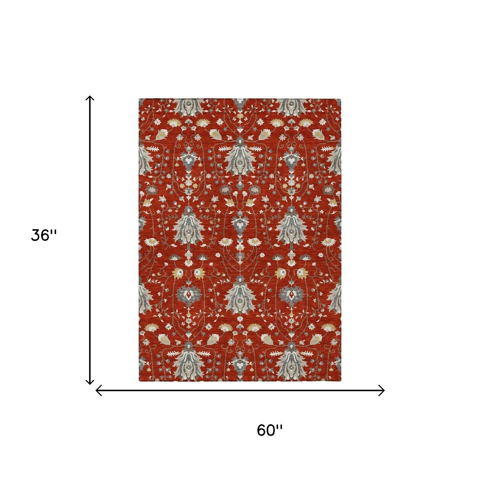 Red oriental area rug with floral medallion pattern, 60 in x 36 in