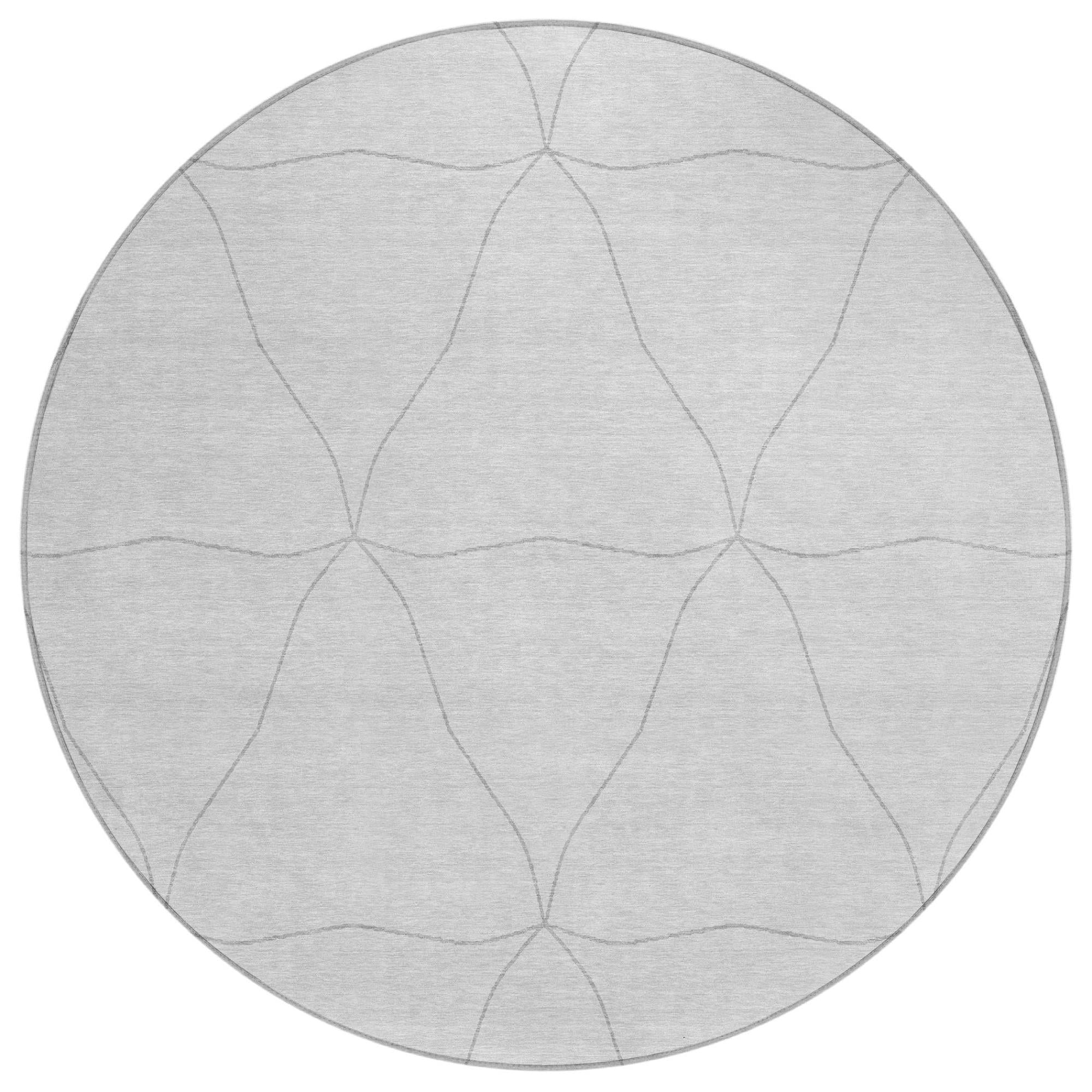 Round light gray area rug with soft graphite geometric lines