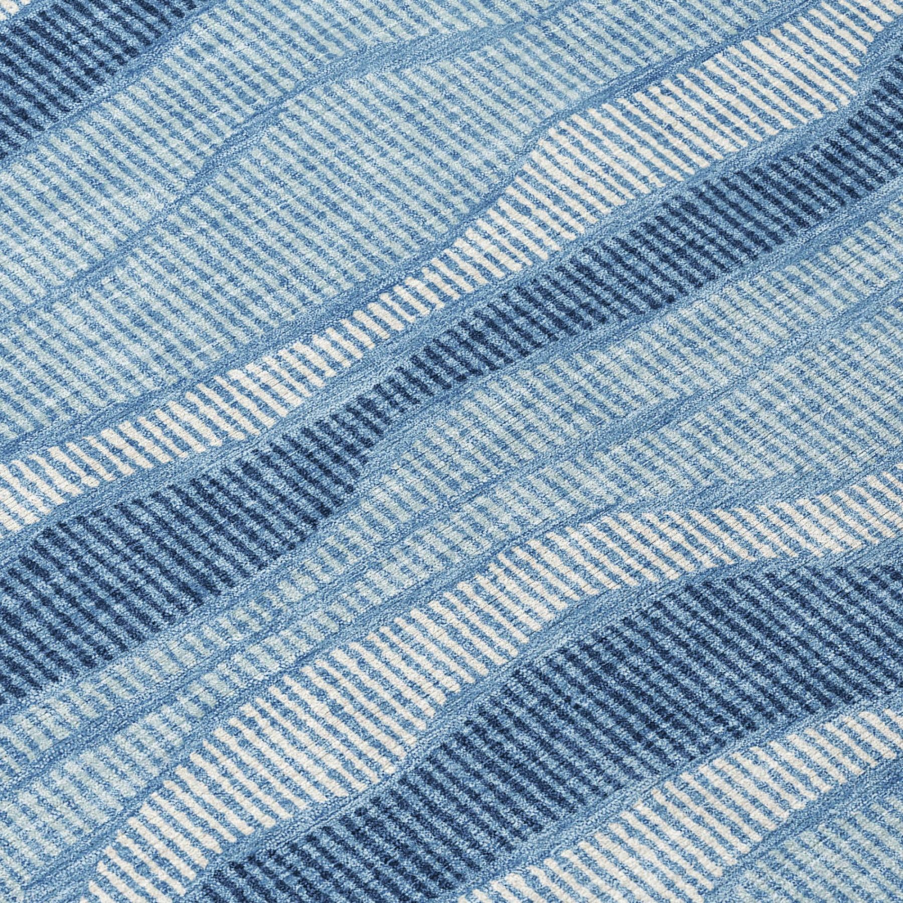 Light and dark blue striped rug with ribbed woven texture