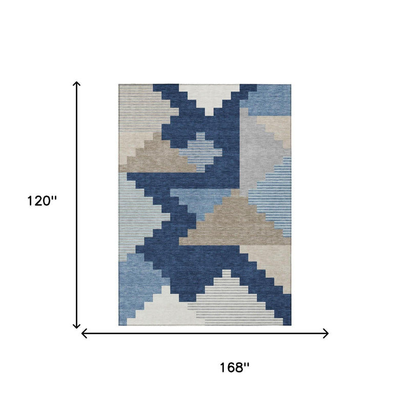 Indoor/outdoor area rug with navy, blue, and beige geometric blocks