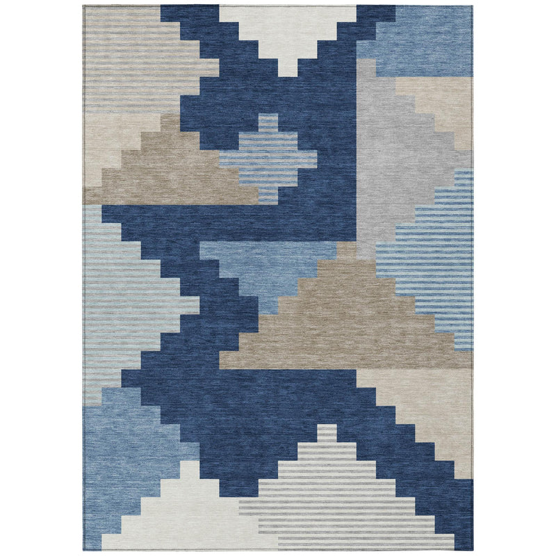 Indoor/outdoor area rug with textured navy, blue, and beige geometric design