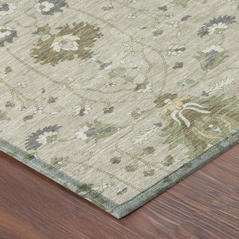 Beige area rug corner with ornate floral lines and medallion motifs in green and gray