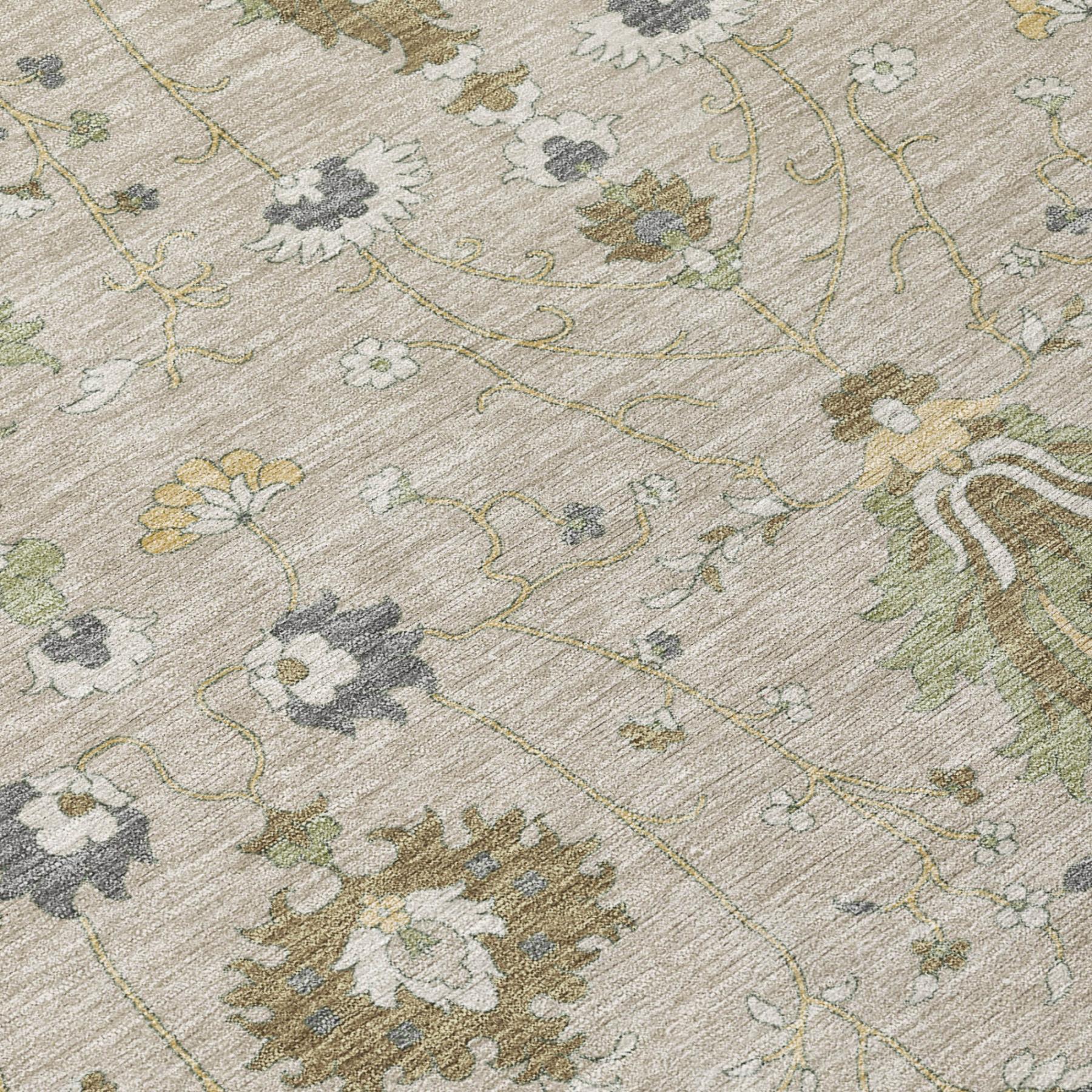 Beige area rug close-up of stitched vine and floral motifs in green, gray, and tan
