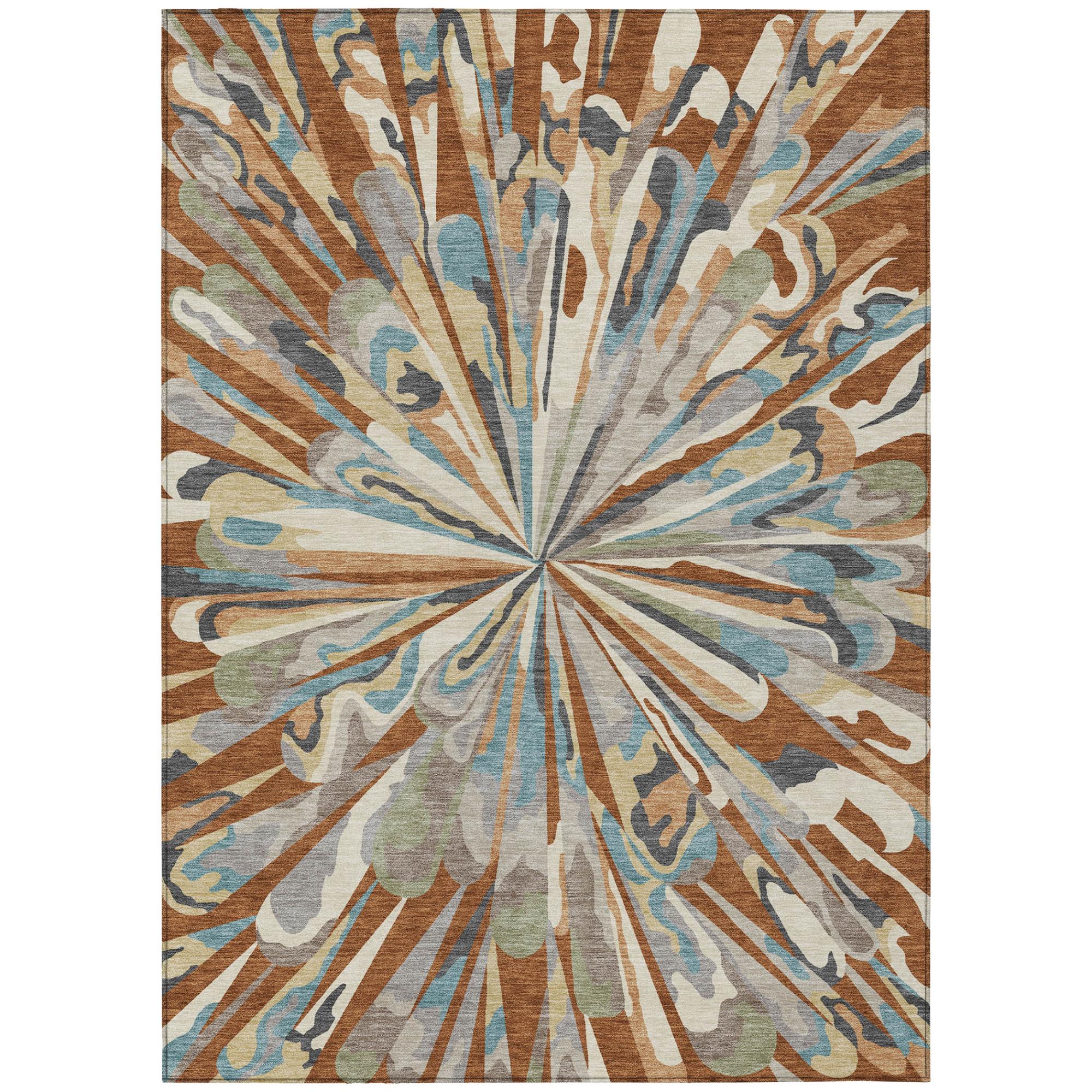 Abstract indoor/outdoor area rug with radial sunburst pattern in orange, teal, and gray tones.
