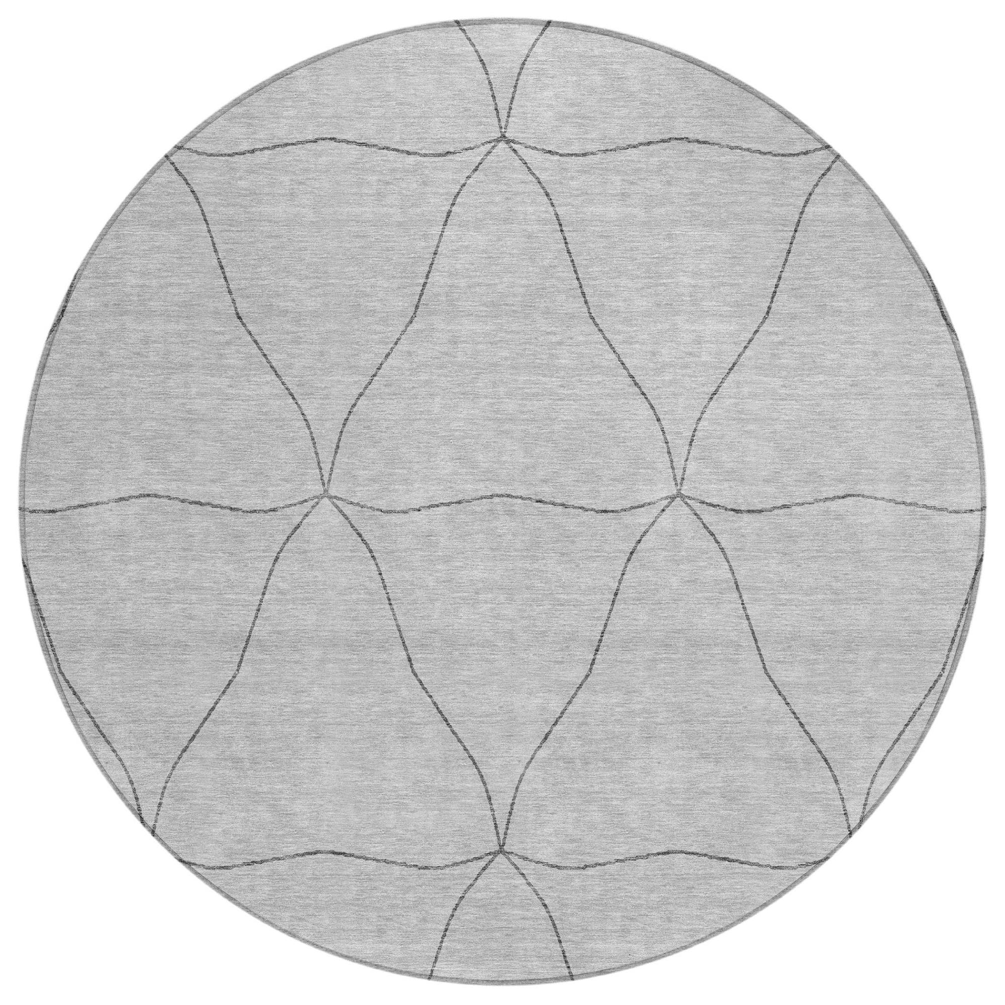 Round gray area rug with overlapping curved geometric lines and lattice pattern