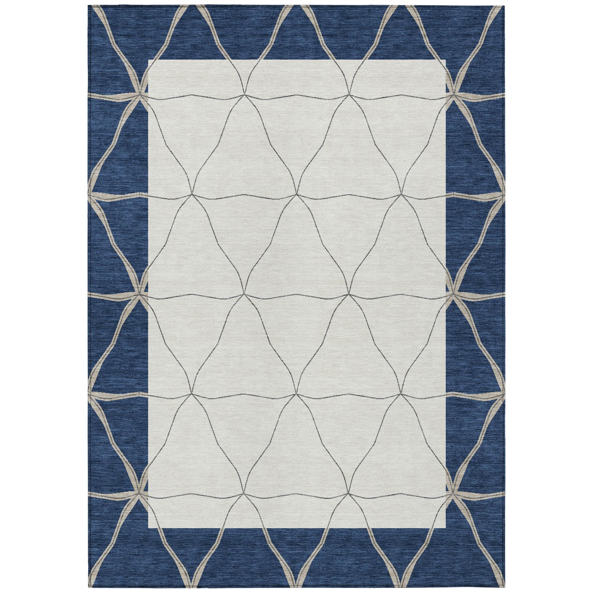 Geometric area rug with navy border, cream diamond pattern, and beige lattice trim
