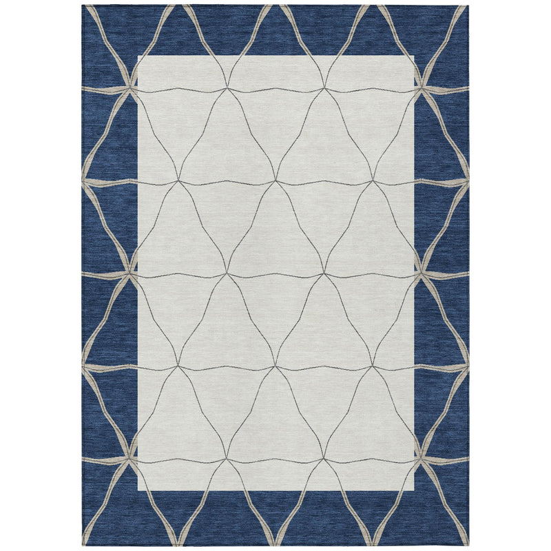 Geometric area rug with navy border, cream diamond pattern, and beige lattice trim