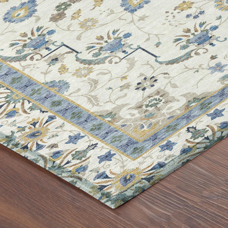 Ivory oriental area rug corner with blue border and multicolor floral vines