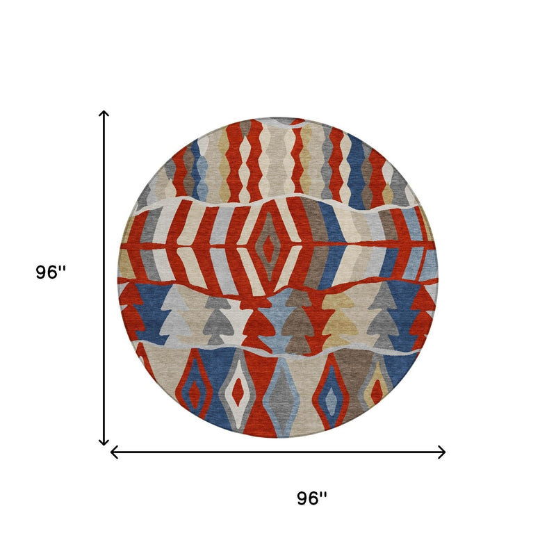 Round geometric area rug with red, blue, gray, and beige abstract design