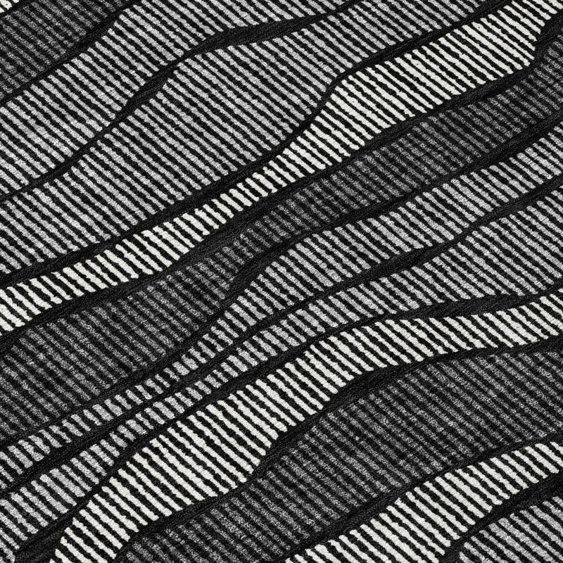 Black and graphite wavy striped area rug with tight textured weave.