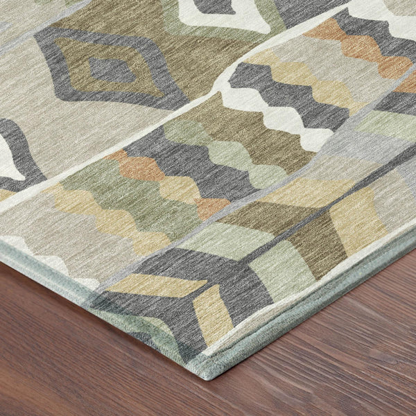 Round area rug with gray, sage, and orange geometric pattern and light border