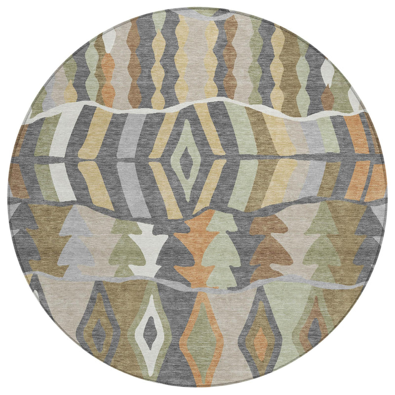 Round area rug with layered geometric motifs in gray, tan, green, and orange