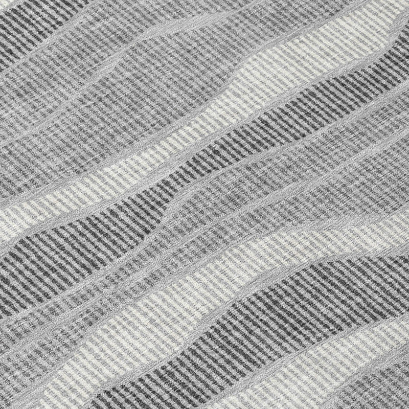 Close-up of pewter and gray wavy striped area rug fabric texture