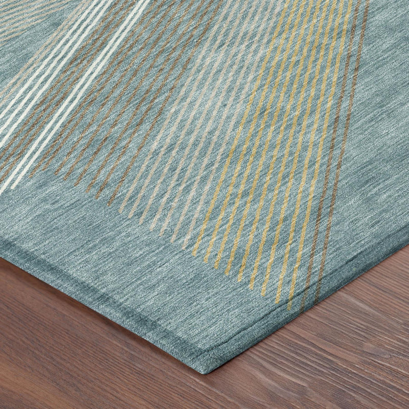 Teal blue geometric area rug corner with woven texture and bound edge