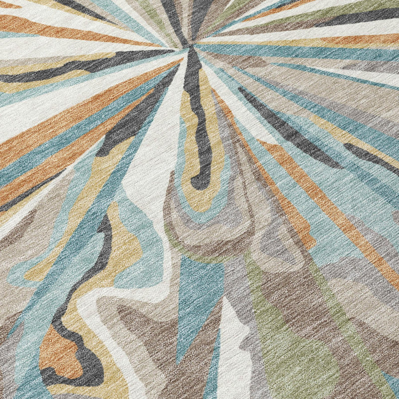 Teal blue, beige, and tan abstract area rug filling frame with radiating fan pattern