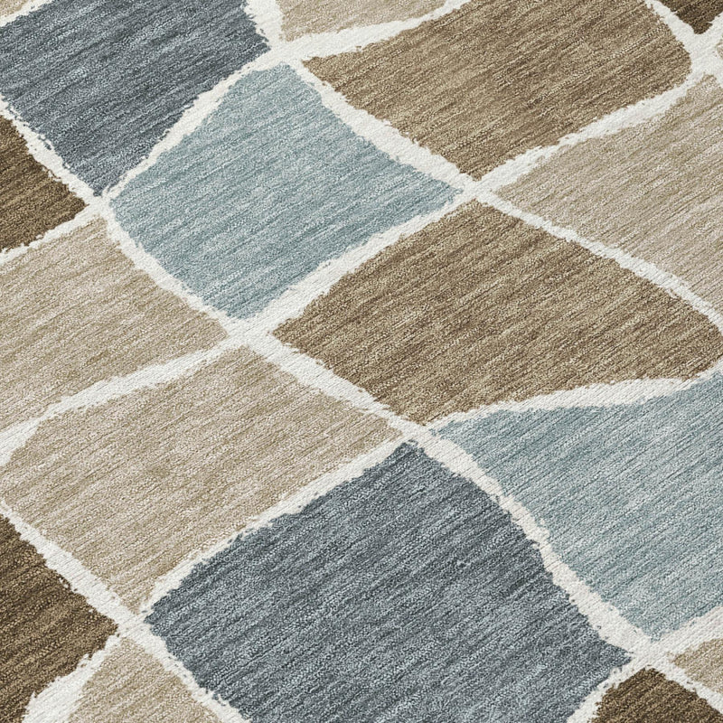 Geometric area rug close-up with beige, brown, and light blue blocks separated by white lines