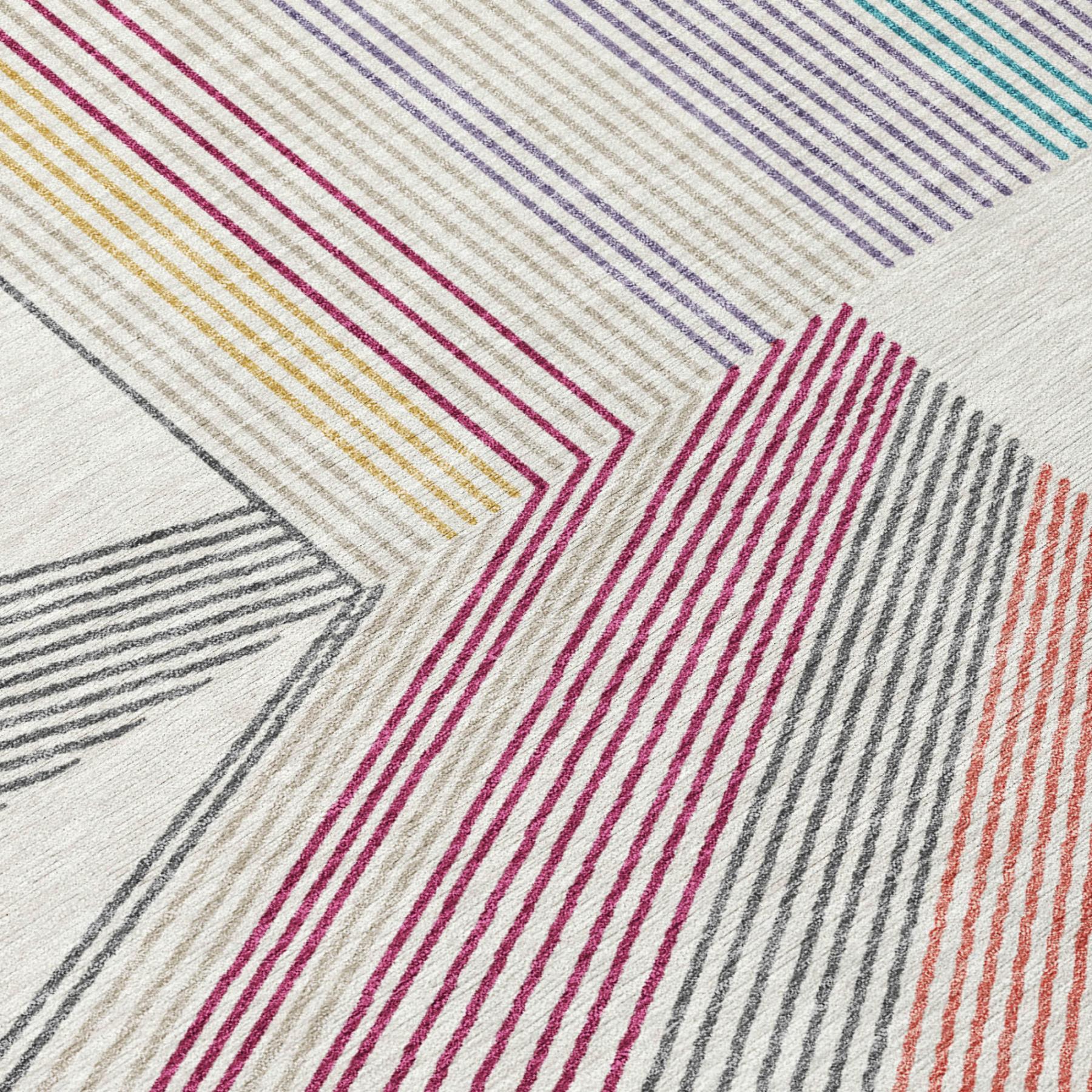 Ivory geometric area rug close-up with magenta, blue, gray and orange stripe pattern