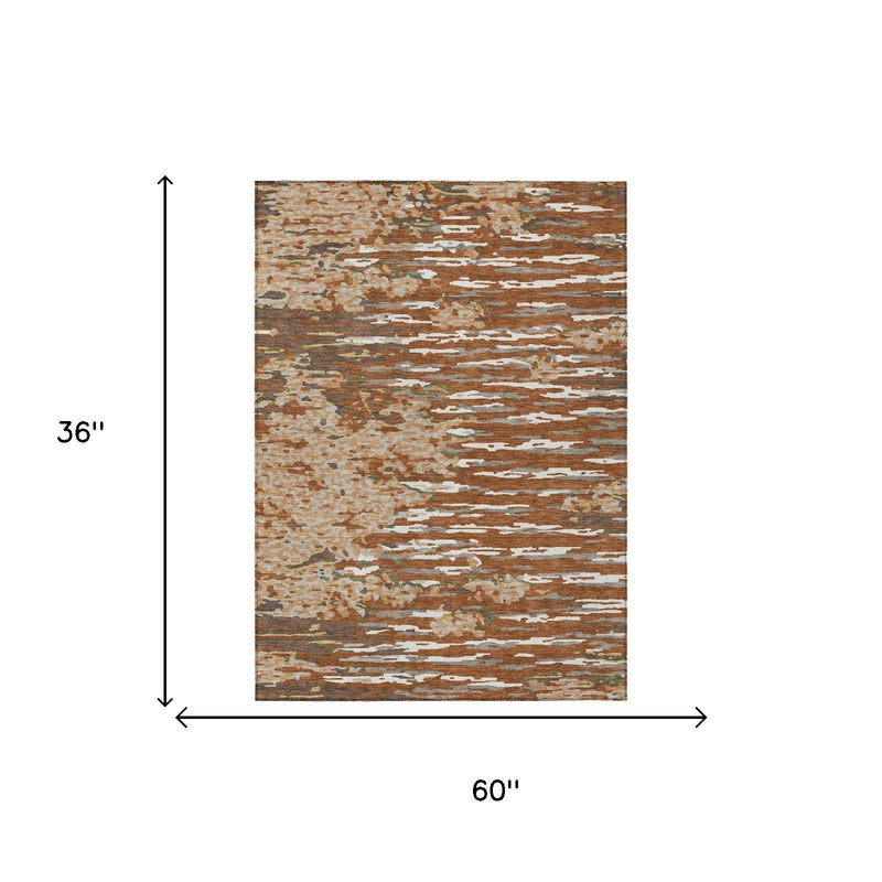 Abstract area rug, orange and beige, rectangular 60 in by 36 in