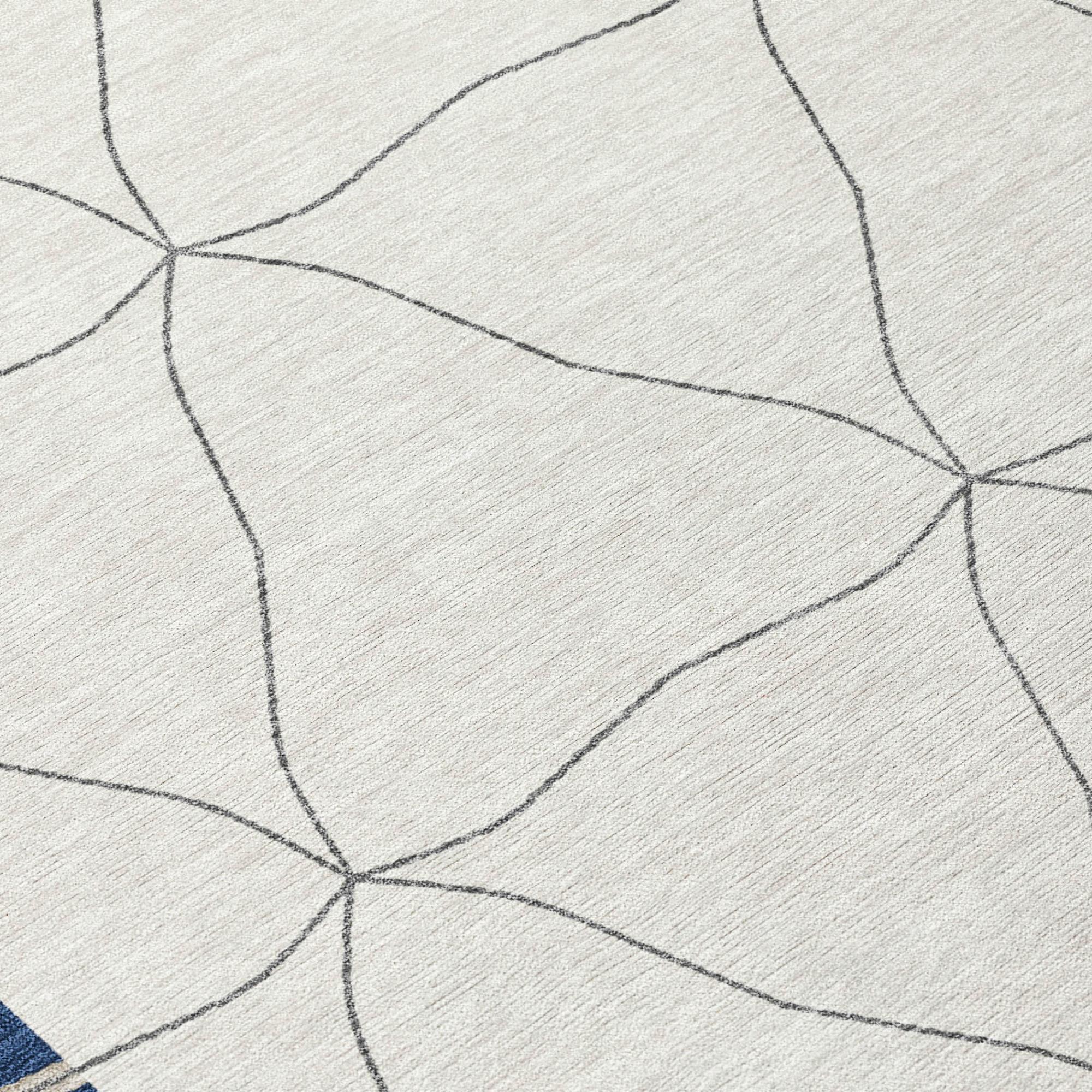 Round rug close-up: light fabric with thin dark gray geometric lines