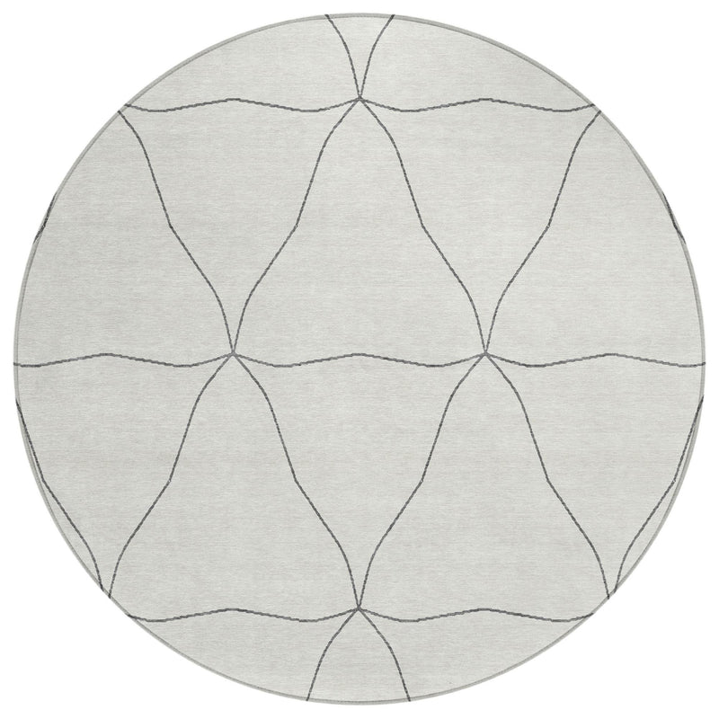 Round area rug with light gray base and repeating gray geometric line pattern