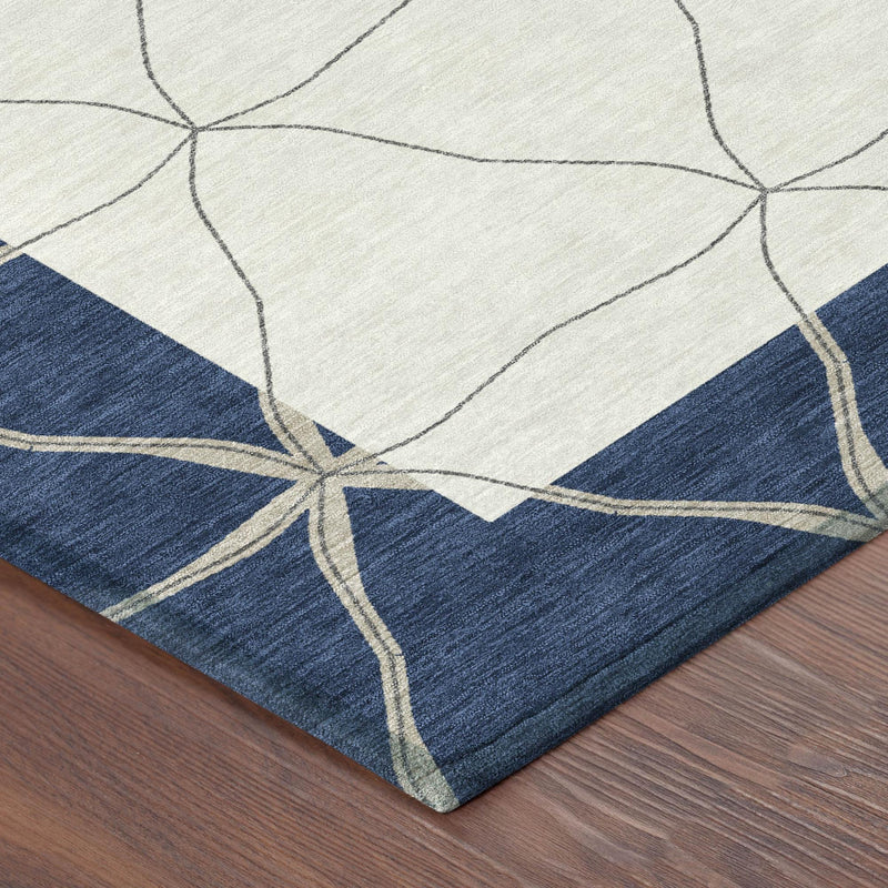 Round rug corner detail: navy and light panels with curved geometric lines