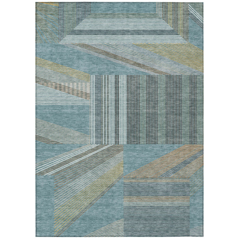 Geometric area rug with teal blue, graphite, and tan patchwork line pattern