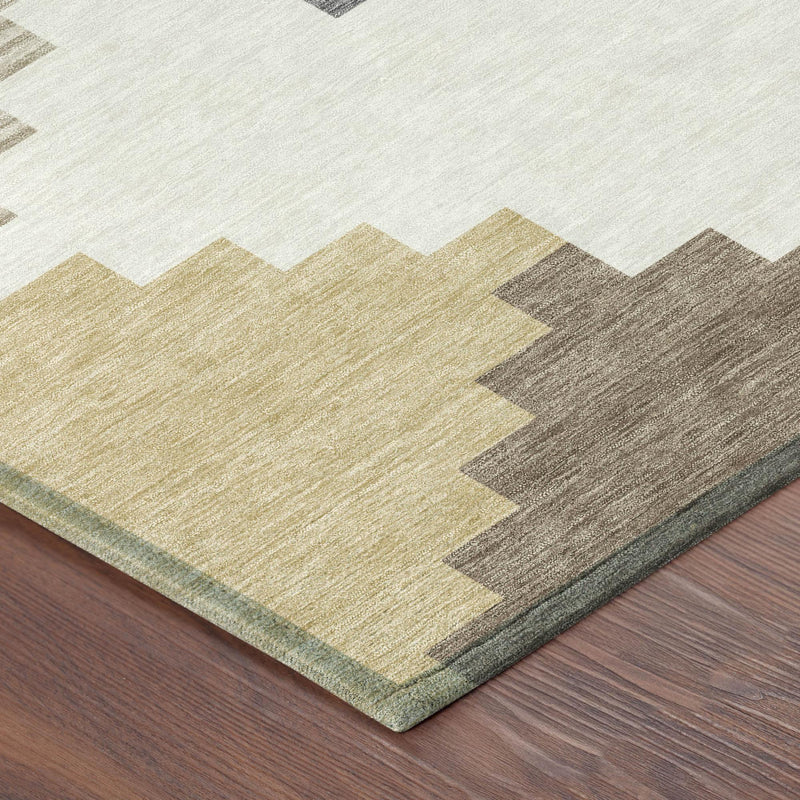 Corner view of ivory geometric area rug with beige and gray stepped blocks