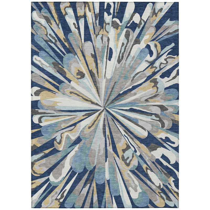 Abstract area rug with circular sunburst motif in navy, light blue, and tan