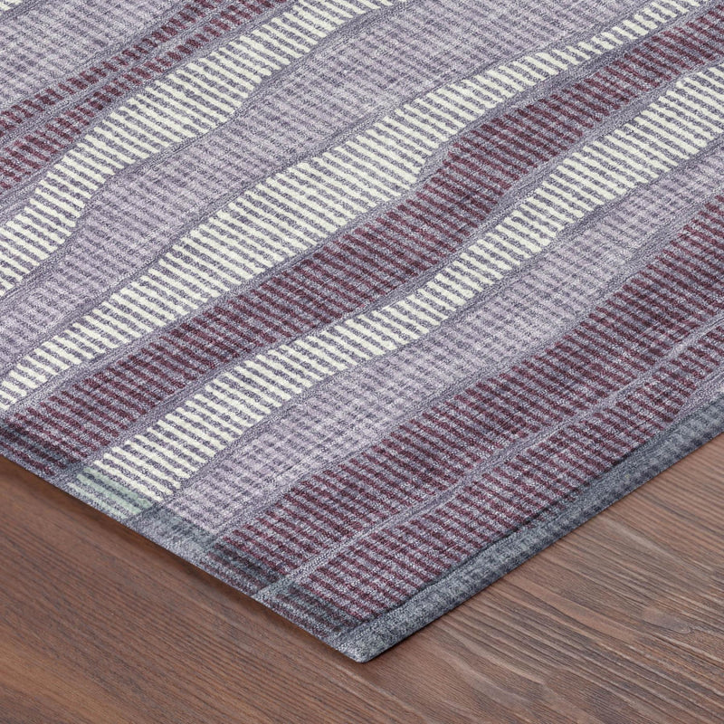 Round corner view of lilac and purple wavy striped area rug with flat edge