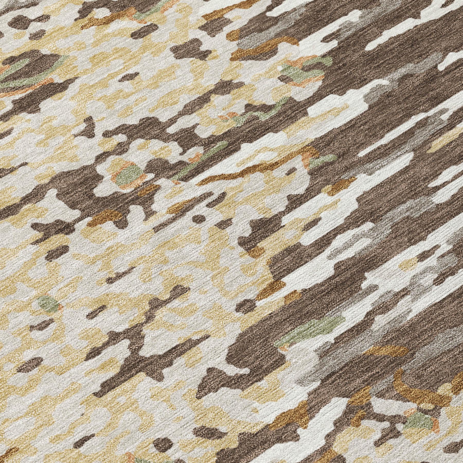 Abstract wash area rug close-up with cream, brown, gray, and olive camo-like distressed strips.