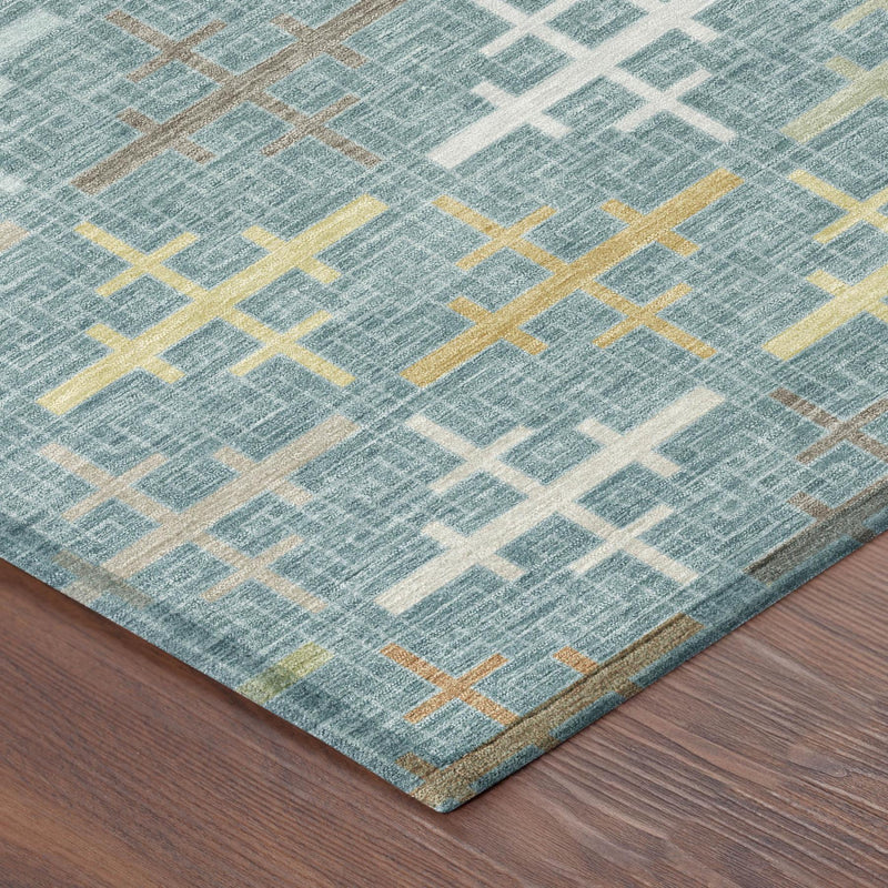 Teal blue geometric cross rug with white and muted gold accents, corner detail