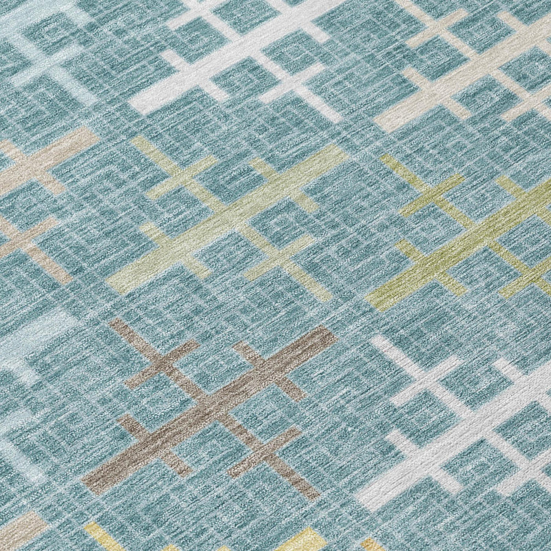 Teal blue and white geometric cross pattern rug with muted gold accent lines