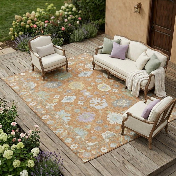 Copper and gold oriental area rug with light blue distressed floral pattern